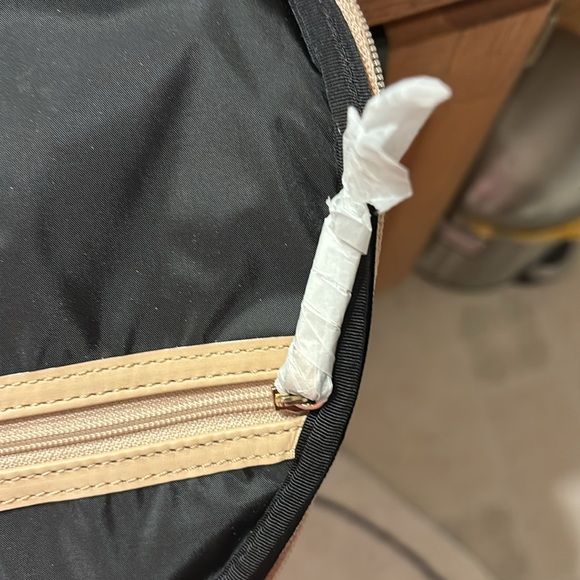 Kate Spade 11” clutch NWT. The only flaw is a small water mark under plastic. - Picture 9 of 16